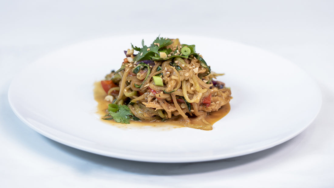 Peanut Chicken Zucchini Noodles on white plate