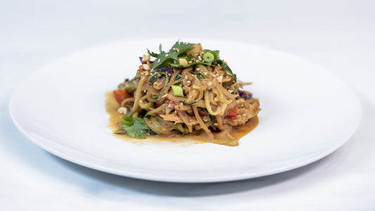 Peanut Chicken Zucchini Noodles on white plate